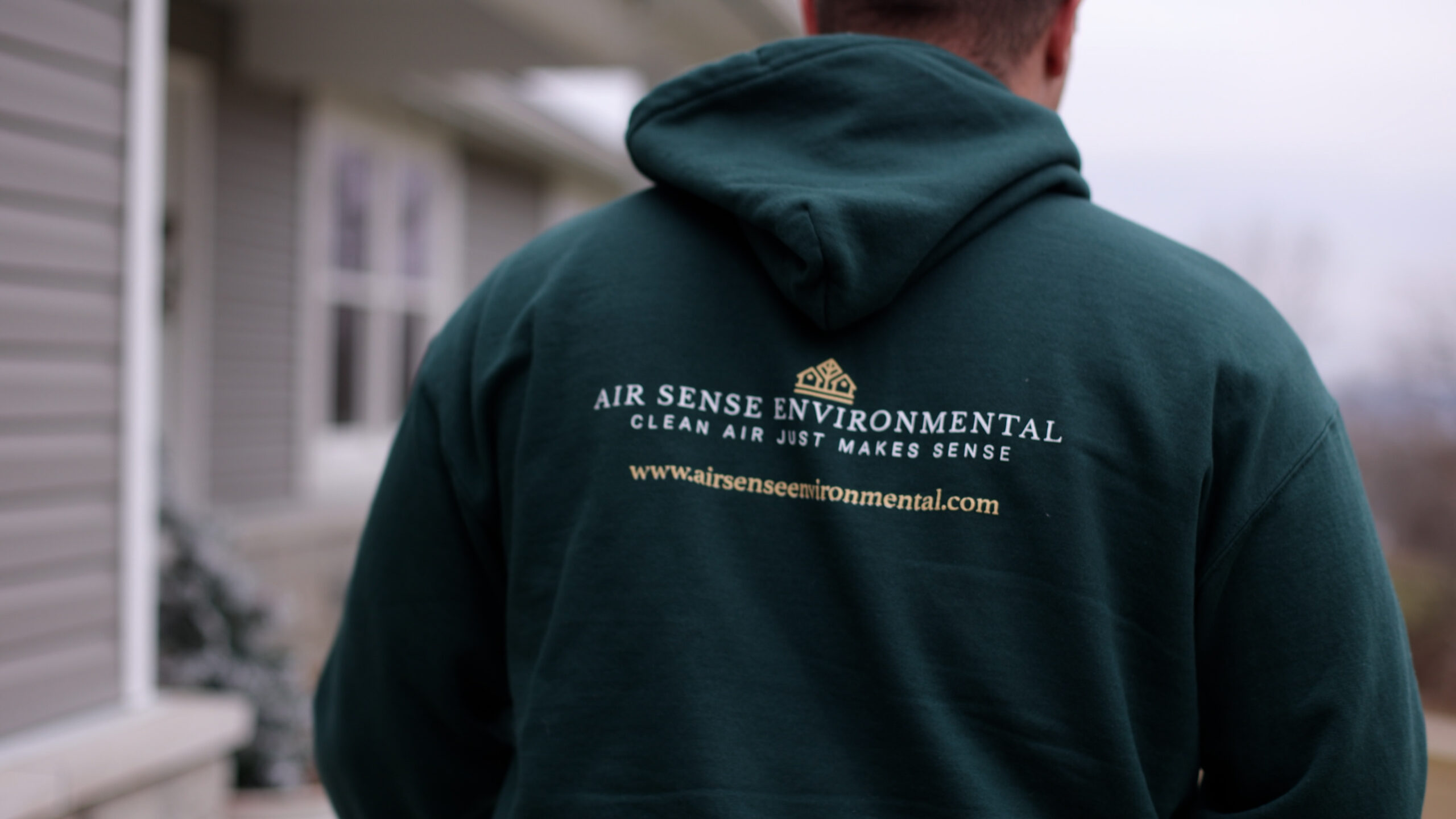 Air Sense team member wearing branded work clothing